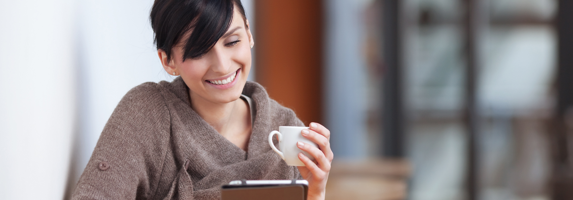 Woman happy with our office coffee services in Montreal, QC.